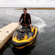 Doug "Censor" Martin riding a motorboat.